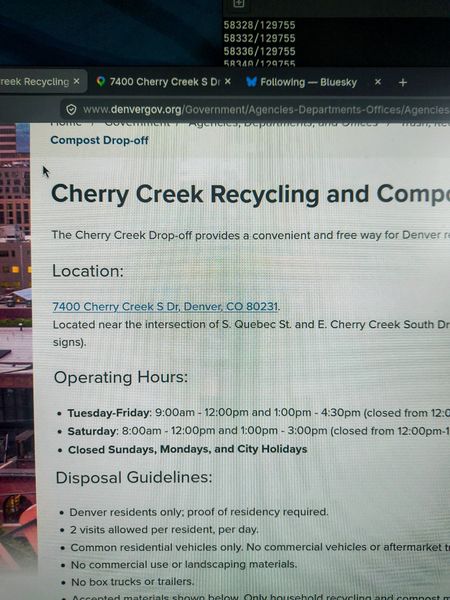 The image displays a webpage from Denvergov.org detailing the Cherry Creek Recycling and Compost Drop-off facility located at 7400 Cherry Creek S Dr, Denver, CO 80231. The page includes operating hours, disposal guidelines, and is set against a blurred background of a cityscape.